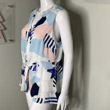 Load image into Gallery viewer, Size Medium Torrid NWOT MULTI GEO GEORGETTE PEPLUM TIE FRONT SLEEVELESS BLOUSE