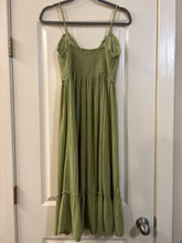 Load image into Gallery viewer, Medium Hint of Blush olive green midi dress featuring a textured crochet V-neck bodice and a tiered, crinkled skirt
