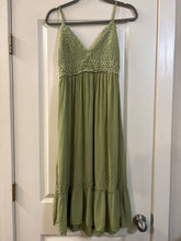 Load image into Gallery viewer, Medium Hint of Blush olive green midi dress featuring a textured crochet V-neck bodice and a tiered, crinkled skirt
