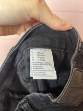 Load image into Gallery viewer, Size 10 American Eagle Black Ultra High Rise Distressed Knee Skinny Jeans
