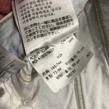 Load image into Gallery viewer, Size 29 Levi’s Light Wash Front Patch Denim Cut Off Shorts
