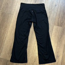 Load image into Gallery viewer, Small Prana Black Cropped Flare Yoga Pants
