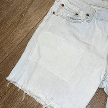 Load image into Gallery viewer, Size 29 Levi’s Light Wash Front Patch Denim Cut Off Shorts
